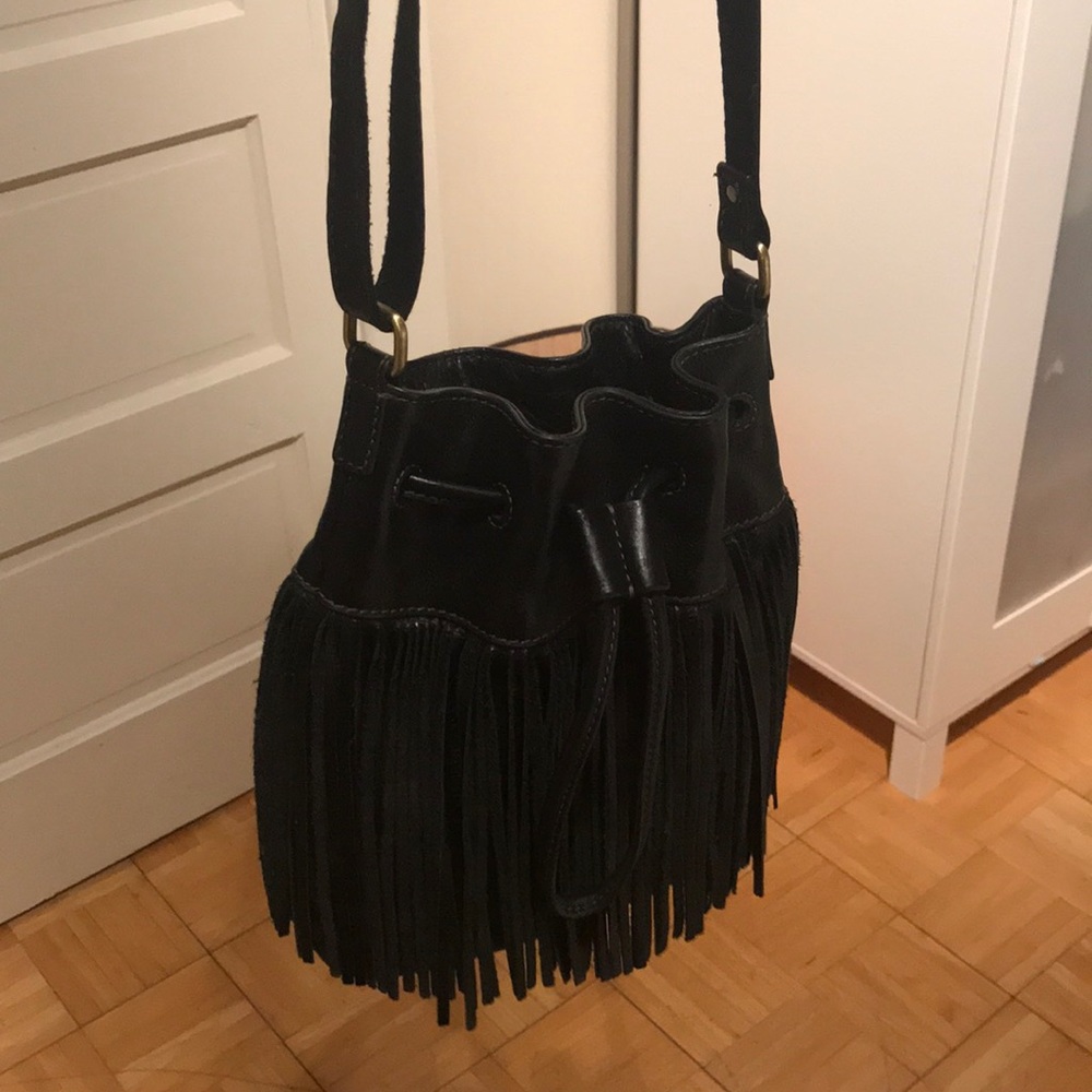 Like new FOSSIL fringe drawstring bucket purse